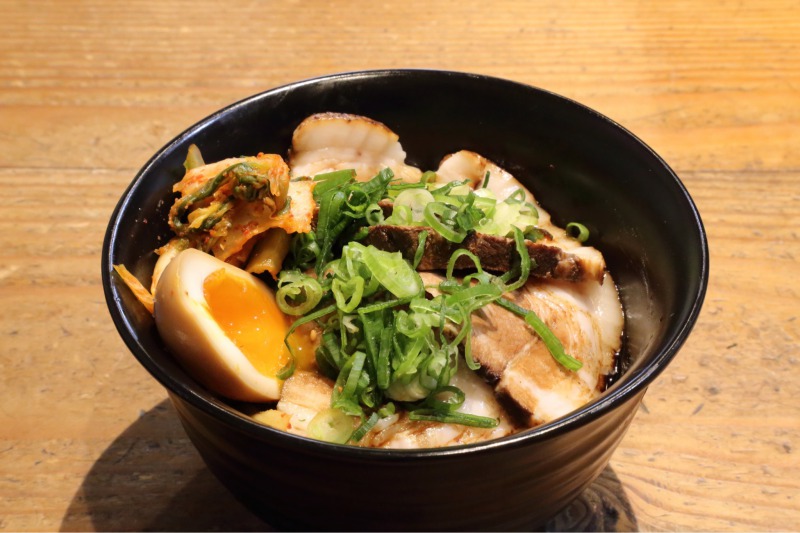 Kura don (rice bowl) with their signature Chashu, simmered egg and kimchi on top.